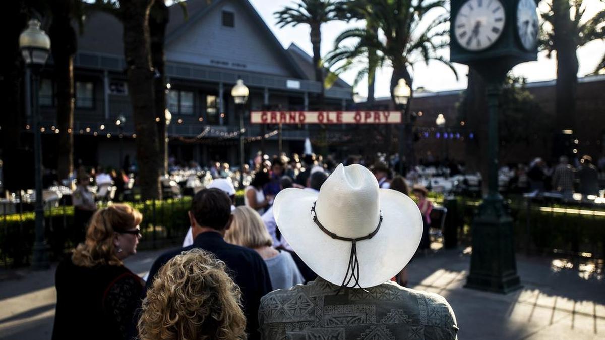 
Guests arrive wearing cowboy hats to Playhouse Merced’s 2015 gala titled A Night at the Opry at Bob Hart Square on Saturday. 
