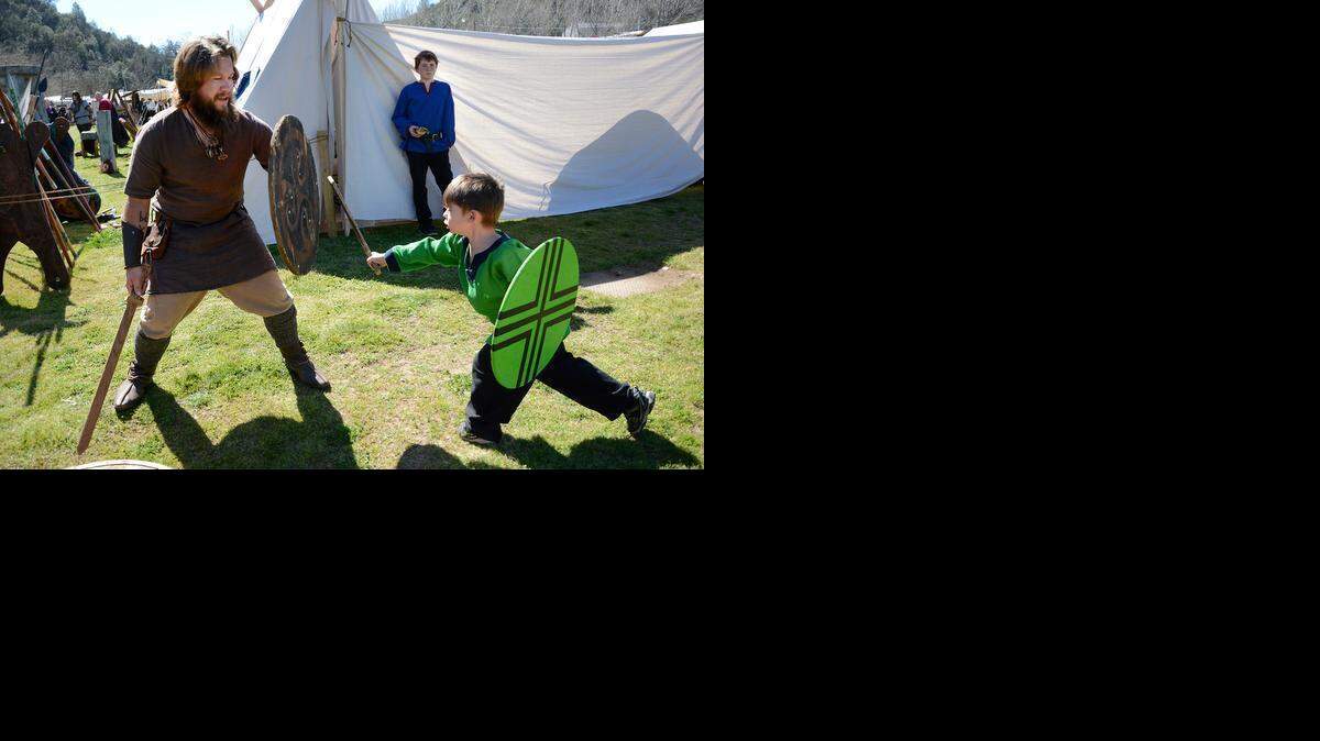 
Stockton resident Billy Lamphiear, left, and 4-year-old Modesto resident Luke Nomicos play-fight during the Sonora Celtic Fair on Friday. They are part of the Dark Boar Viking re-enacting group. The 29th annual Sonora Celtic Faire runs Friday through Sunday.
