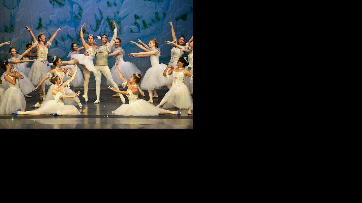
Michael Terry, 16, of Merced, center left, and Wally Layne, 32, of Modesto, center right, perform during a dress rehearsal Wednesday of “The Nutcracker,” performed by the Merced Academy of Dance at Buhach Colony High School in Atwater, Calif., Wednesday, Dec. 3, 2014. Opening night of the ballet is Friday, Dec. 5, 2014.
