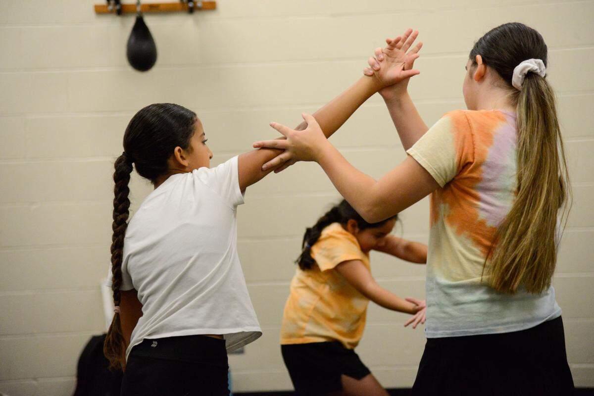 Students Isabella Granados (left), Natalie Gonzalez (middle), and Zoe O’Donnell (right) practicing self-defense moves on Monday June 24, 2024.