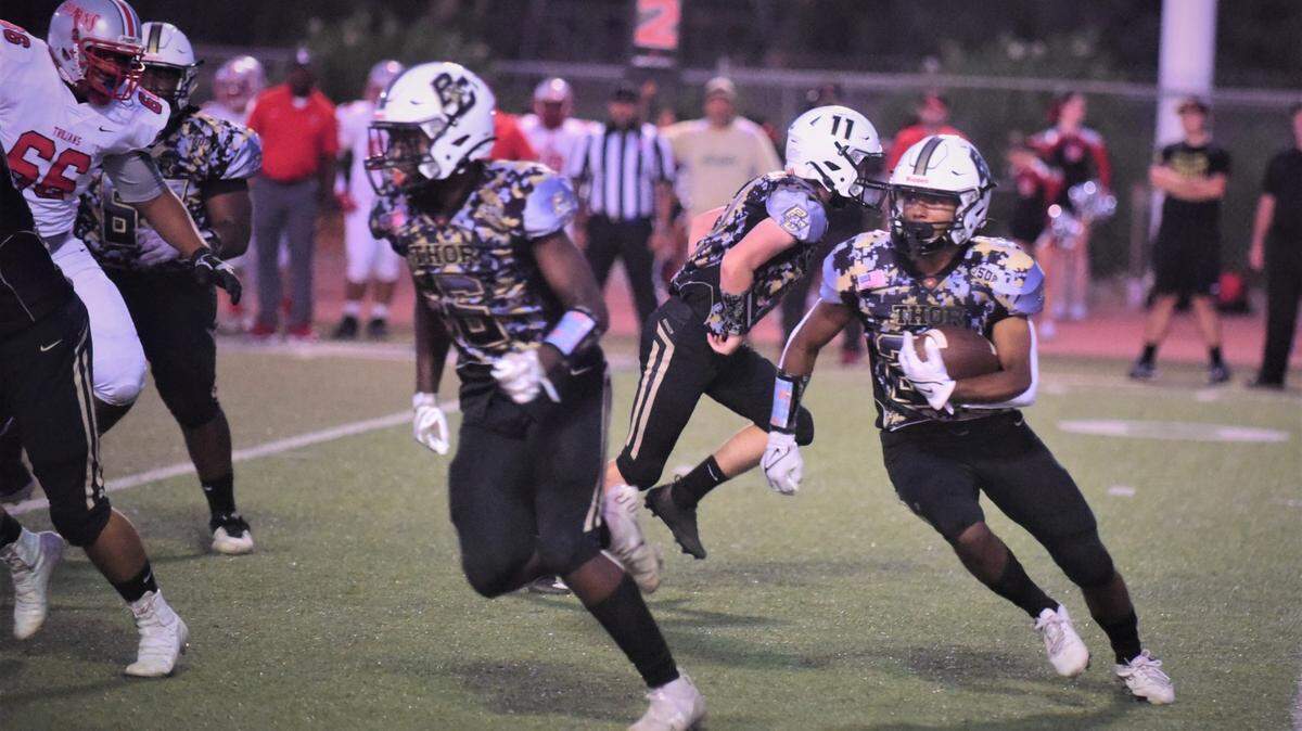 Buhach Colony’s Jaxson Percoats looks for running room against Lincoln during a game on Friday, Sept. 10, 2021 at Dave Honey Stadium in Atwater, Calif.