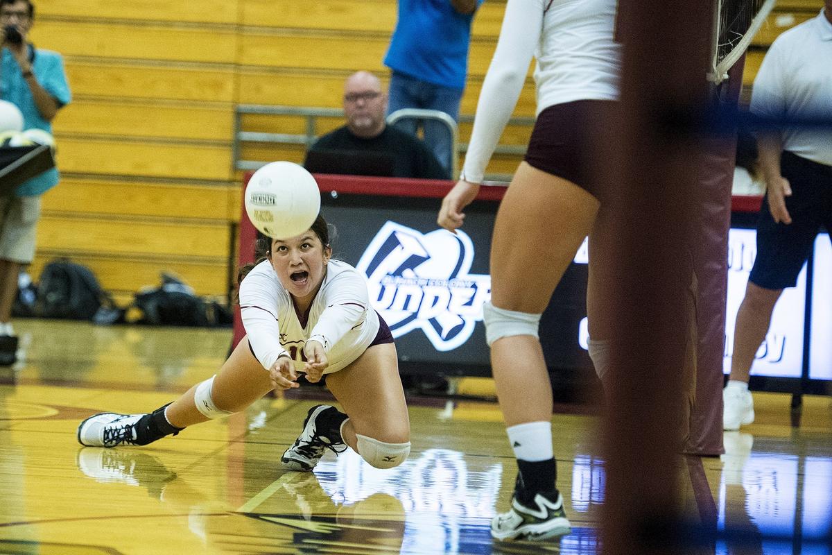 Golden Valley sophomore Aleena Jimenez (16) dives to hit the ball during a match against Buhach Colony at Golden Valley High School in Merced, Calif., on Wednesday, Sept. 5, 2018. The Thunder beat the Cougars 3-0.