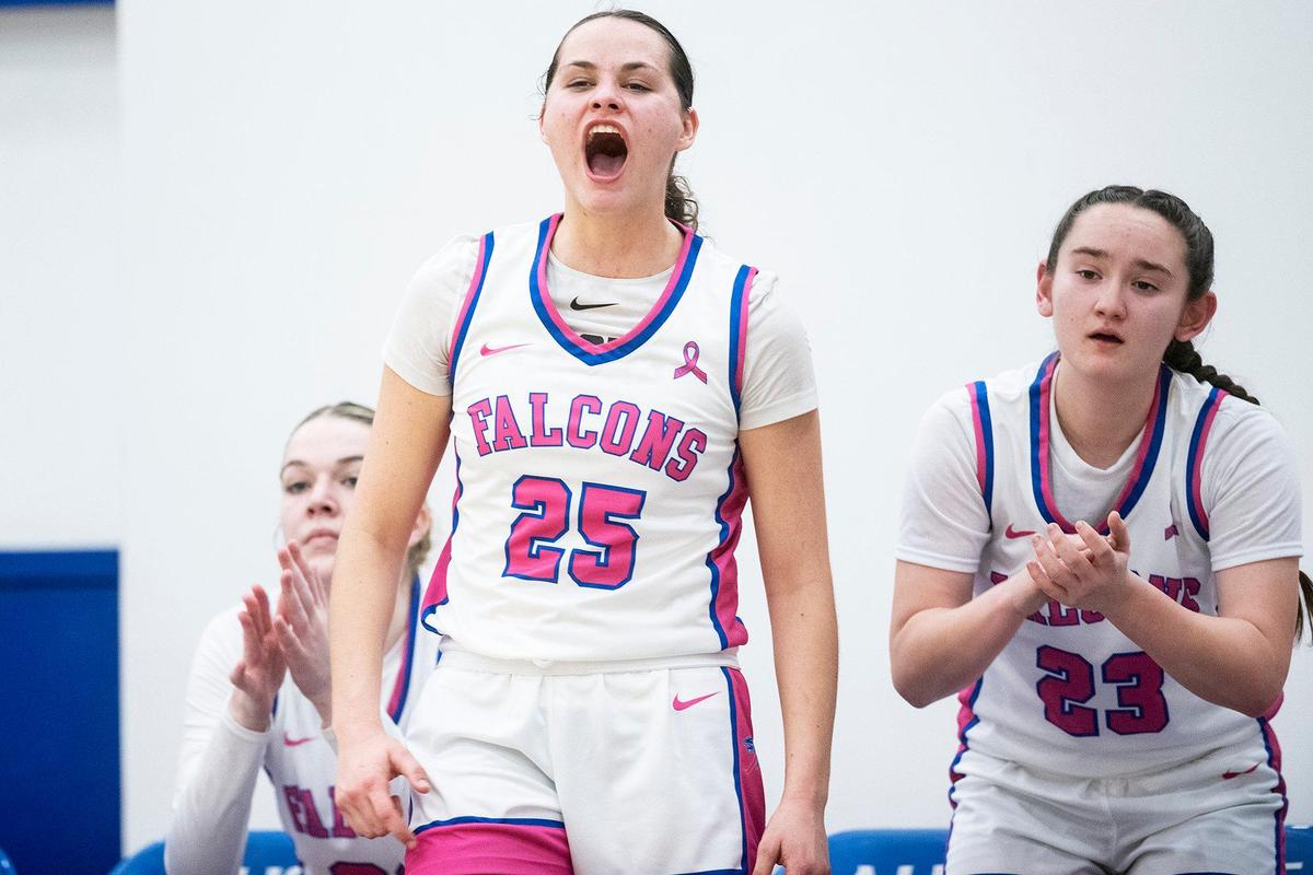 Atwater junior Karissa Hukill (25) and the rest of the bench react to a Falcons basket during a CIF Sac-Joaquin Section Division 2 playoff game against Mountain House at Atwater High School in Atwater, Calif., on Wednesday, Feb. 14, 2024. The Falcons beat the Mustangs 95-59.