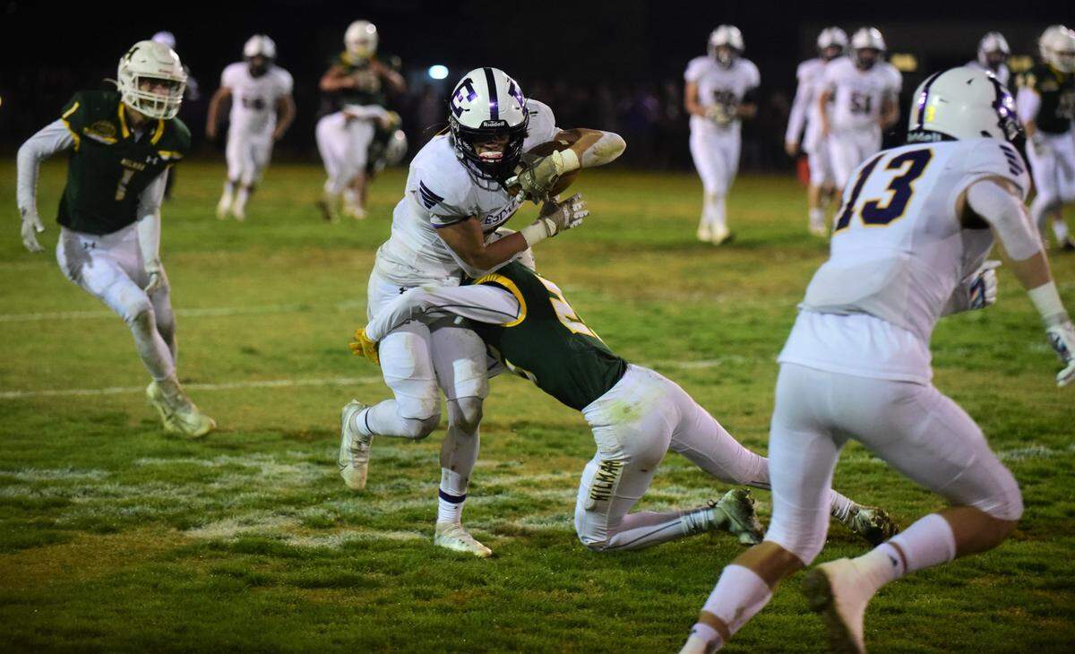 Escalon High senior Logan Anderson runs the ball against Hilmar during a playoff game on Friday, Nov. 11, 2022, at McSweeney Field in Hilmar, Calif.