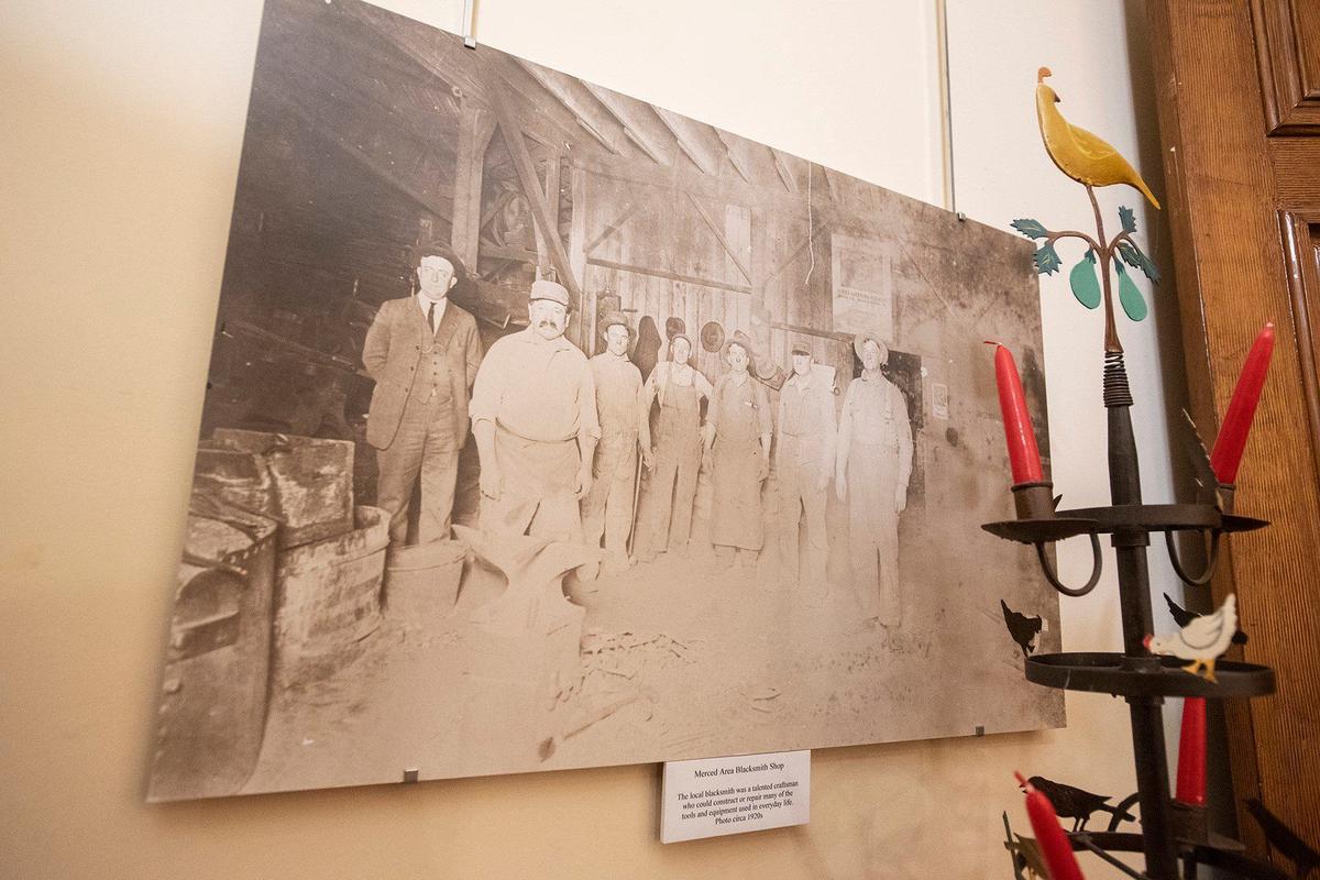 A photo dating back to the 1920s, shows a Merced area blacksmith shop, at the Merced County Courthouse Museum in Merced, Calif., on Thursday, Aug. 22, 2024. Built in 1875, the building served as a courthouse until 1950 and as a county administration building until 1970. The building opened as a history museum in 1983.