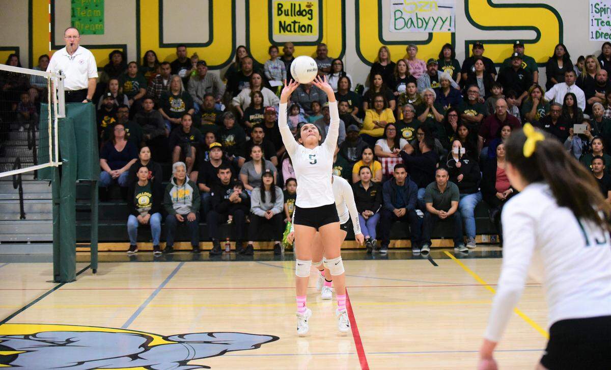 Le Grand’s Elisa Zarate sets the ball during a playoff match against Ripon Christian on Tuesday, Nov. 5, 2019 at Le Grand High.