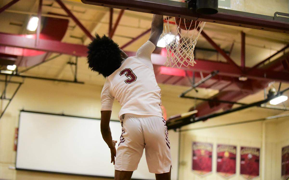 Golden Valley senior Aurrion Harris dunks a ball during a game against Merced HIgh on Friday, Feb. 14, 2020 at Cougar Arena.