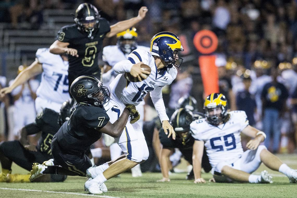 Buhach Colony junior O’shea Ward (7) tackles Gregori junior quarterback Baker Melendez (12) for a loss during a game at Atwater High School in Atwater, Calif., on Friday, Aug. 17, 2018. The Thunder beat the Jaguars 13-6.