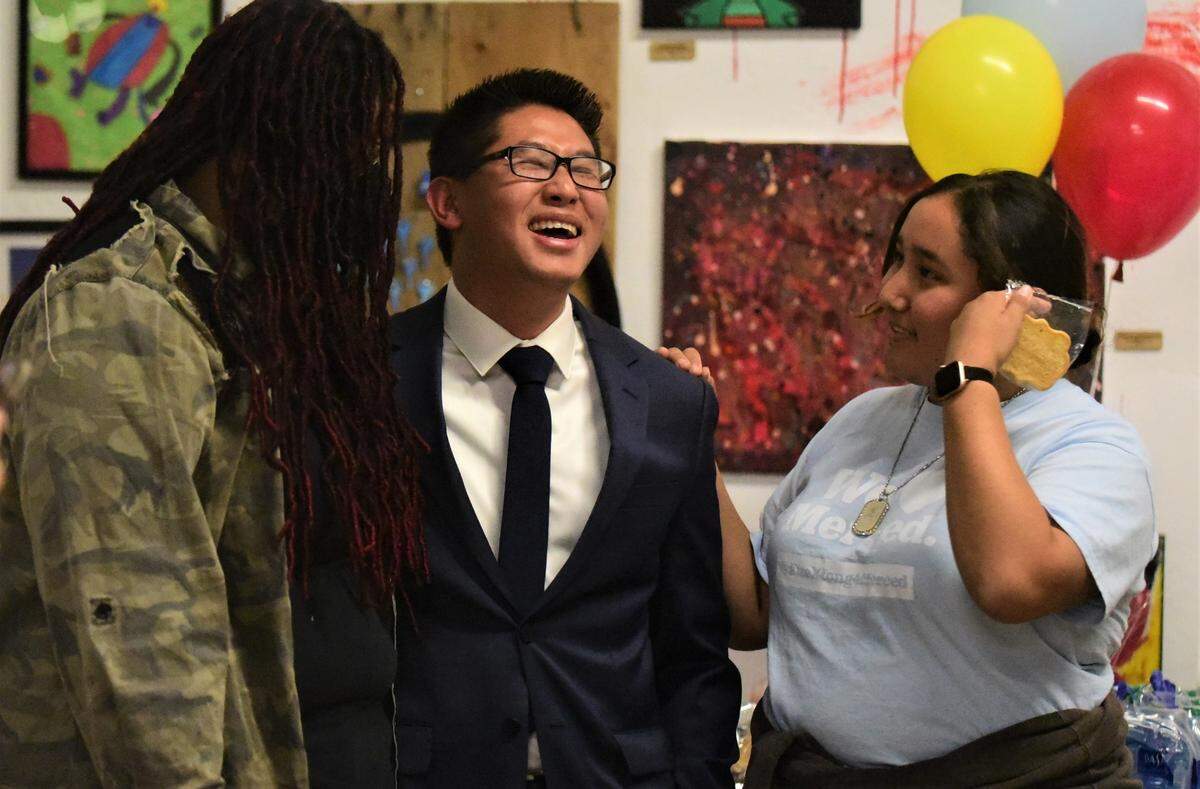 Merced City Council District 6 candidate Fue Xiong laughs during his election party at Kreepy Kawaii Designs on Tuesday, Nov. 8, 2022 in Merced, Calif.