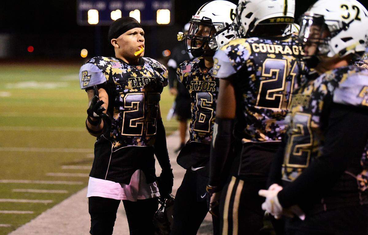 Buhach Colony senior Youlas Dickson chats with teammates on the Thunder sideline during Buhach Colony’s 64-0 win over El Capitan on Thursday, Oct. 3, 2019 at Dave Honey Stadium in Atwater, Calif.