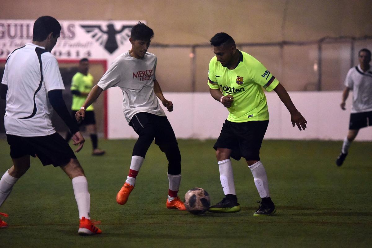 Adults play Friday, Sept. 21, 2018, on the soccer pitch used by about 3,000 children and adults every month in the Merced Indoor Sports Center at 115 Heron Way. Parents and others reacted with outrage on Friday when they learned the facility will be turned into a cannabis business.
