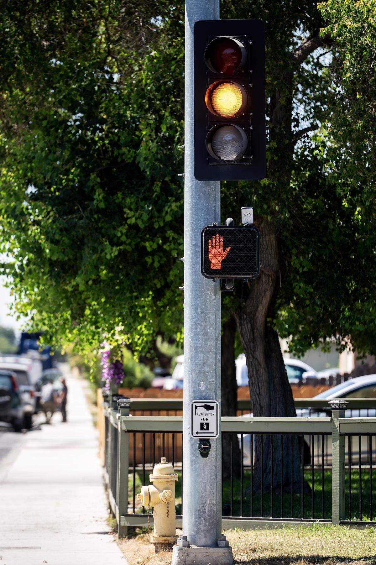 Traffic and pedestrian signals at the intersection of Olive and Parsons avenues in Merced, Calif., on Thursday, July 31, 2025. 