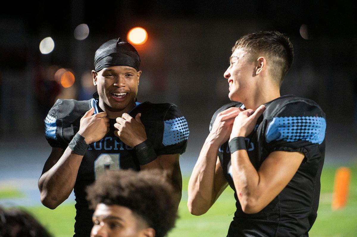 El Capitan seniors Dejuan Franklin (6) left, and Diego Ultreras (1) right, following the Gauchos’ 34-0 win over Beyer at Stadium 76 in Merced, Calif., on Friday, Sept. 6, 2024.