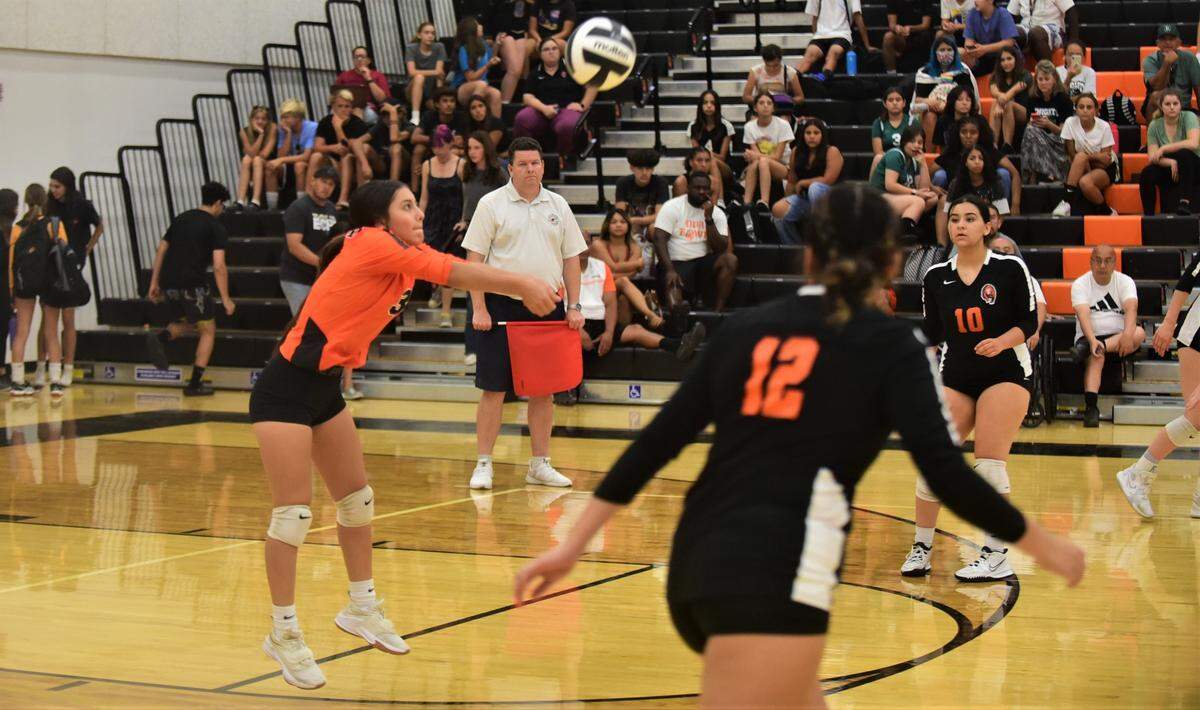 Merced High School libero Analiese Flores digs a ball against El Capitan on Wednesday, Sept. 7, 2022 at Merced High School.