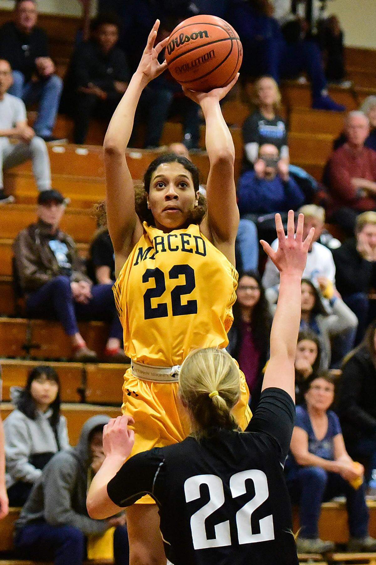Merced College freshman Jada Johnsaon (22) attempts a jump shot over a Cabrillo defender during a game against in Merced, Calif., on Saturday, March 9, 2019. 