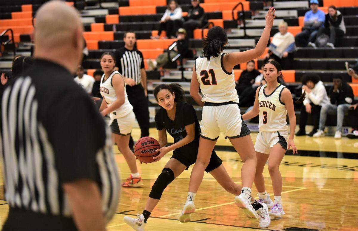 El Capitan High senior Mya Farr (3) looks for a shot against Merced’s Emerson Garcia (21) during a game on Tuesday, Jan. 3, 2022 at Merced High School.