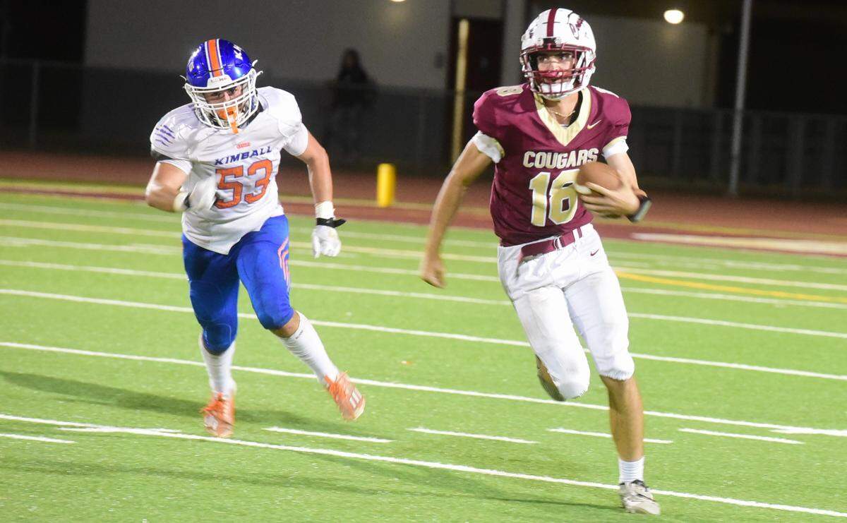 Golden Valley High quarterback Gabriel Richards (18) runs the ball down the field during a game against Kimball on Friday, Sept. 20, 2024 at Veterans Stadium in Merced, Calif.