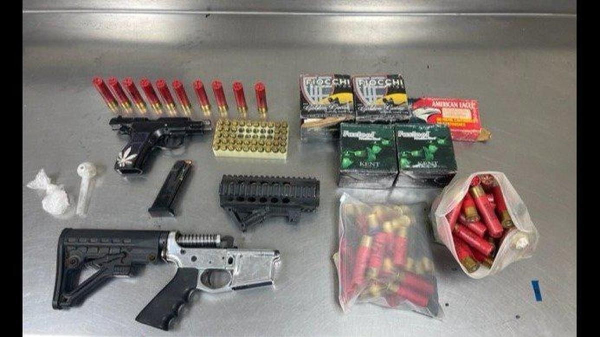 A man was booked into Merced County Jail and another cited and released after officers located a stolen vehicle, gun, gun parts, ammunition and narcotics during a search of a residence on Saturday, April 16, 2022, according to the Merced Police Department. Image courtesy of Merced Police Department.