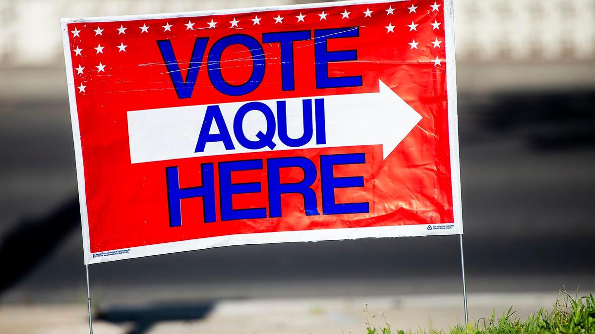 A sign outside the Merced County Administrative Building directs voters to a polling location in Merced, Calif., on Tuesday, March 3, 2020.