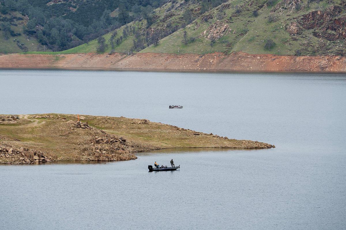 Fishermen are seen navigating the water at Lake McClure in Mariposa County, Calif., on Monday, Feb. 24, 2025.