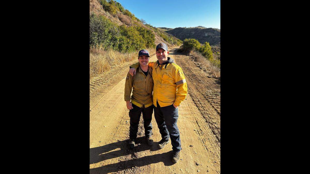 Merced City Fire Captain Bryan Akers, right, and his son Mason, left, while deployed to assist with firefighting efforts on the Palisades Fire in Los Angeles County. Mason works for the Cal Fire Tuolumne-Calaveras Unit. Image courtesy of Bryan Akers Merced City Fire Department.