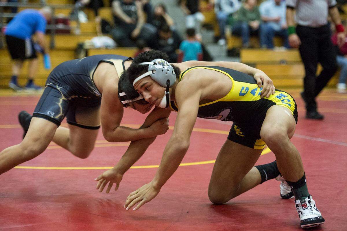 El Capitan’s Devin Holman, right, will try to help lead the Gauchos to their first Central California Conference championship at the CCC Wrestling Championships at Merced High on Thursday.