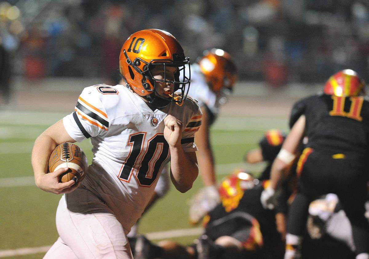 Merced High School quarterback, Seth Schedit scores a touchdown with 49 seconds remaining in the third quarter Friday night, Nov. 22, 2019 against Oakdale High in Oakdale to make the score 31-27 Oakdale.