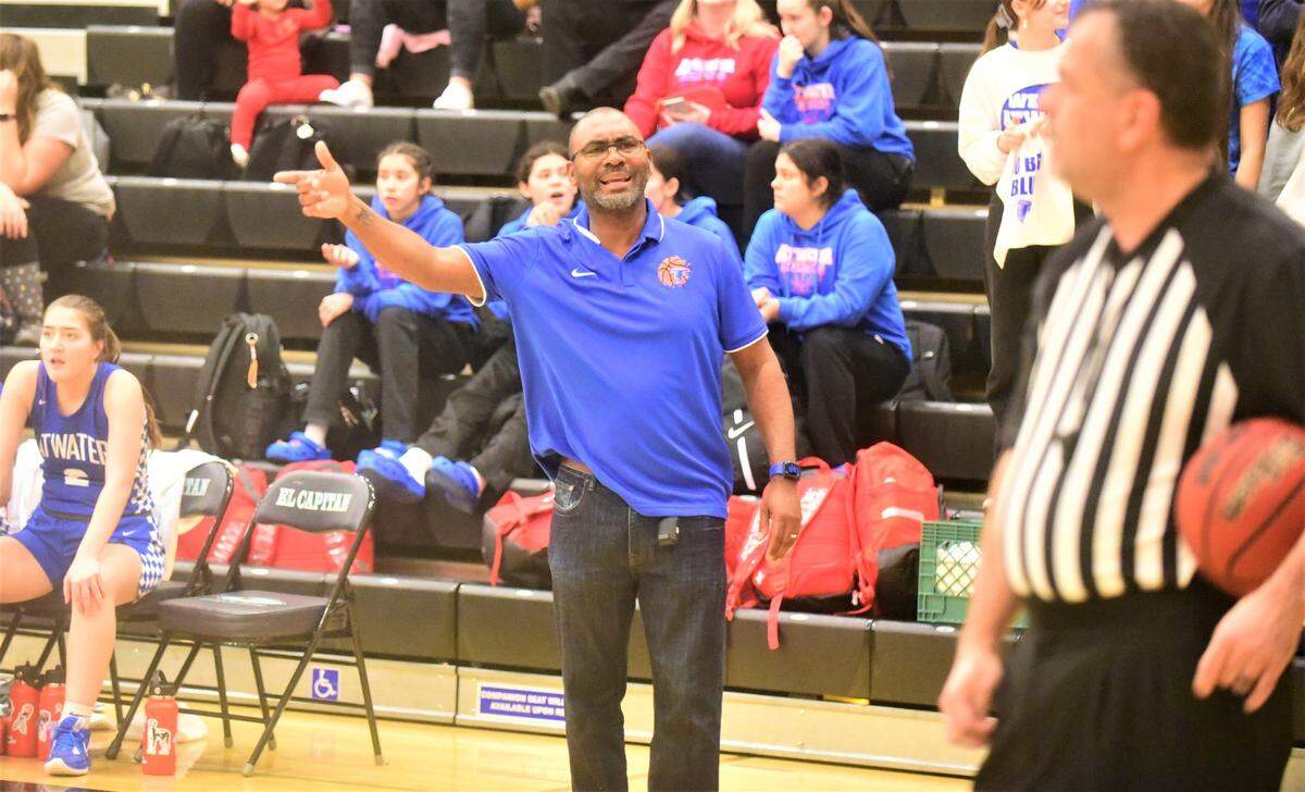 Atwater High girls basketball coach JR Davis argues a call during a game against El Capitan on Thursday, Jan. 12, 2023.