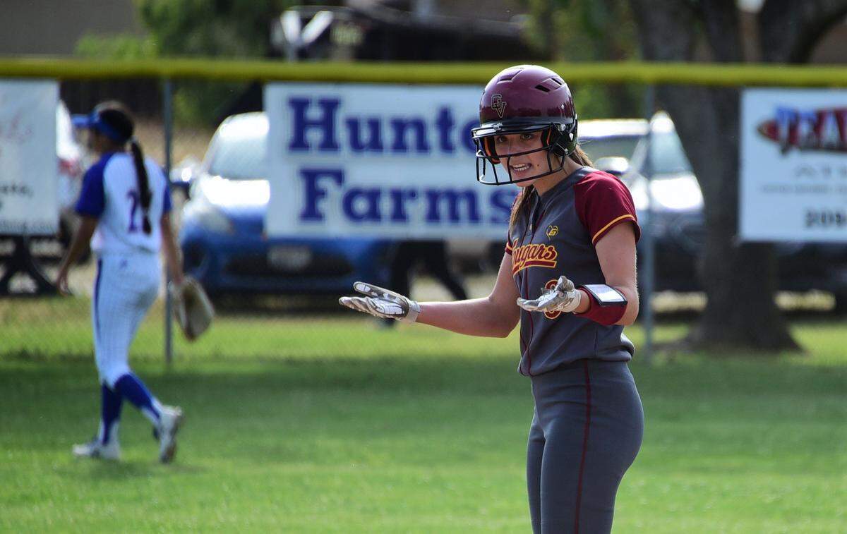 Golden Valley High senior Marissa Bertuccio tells her teammates to get up in the dugout after she drives in a run with a single during the sixth inning of the Cougars’ 2-0 win over Atwater on Monday, May 6, 2019 at Atwater High.