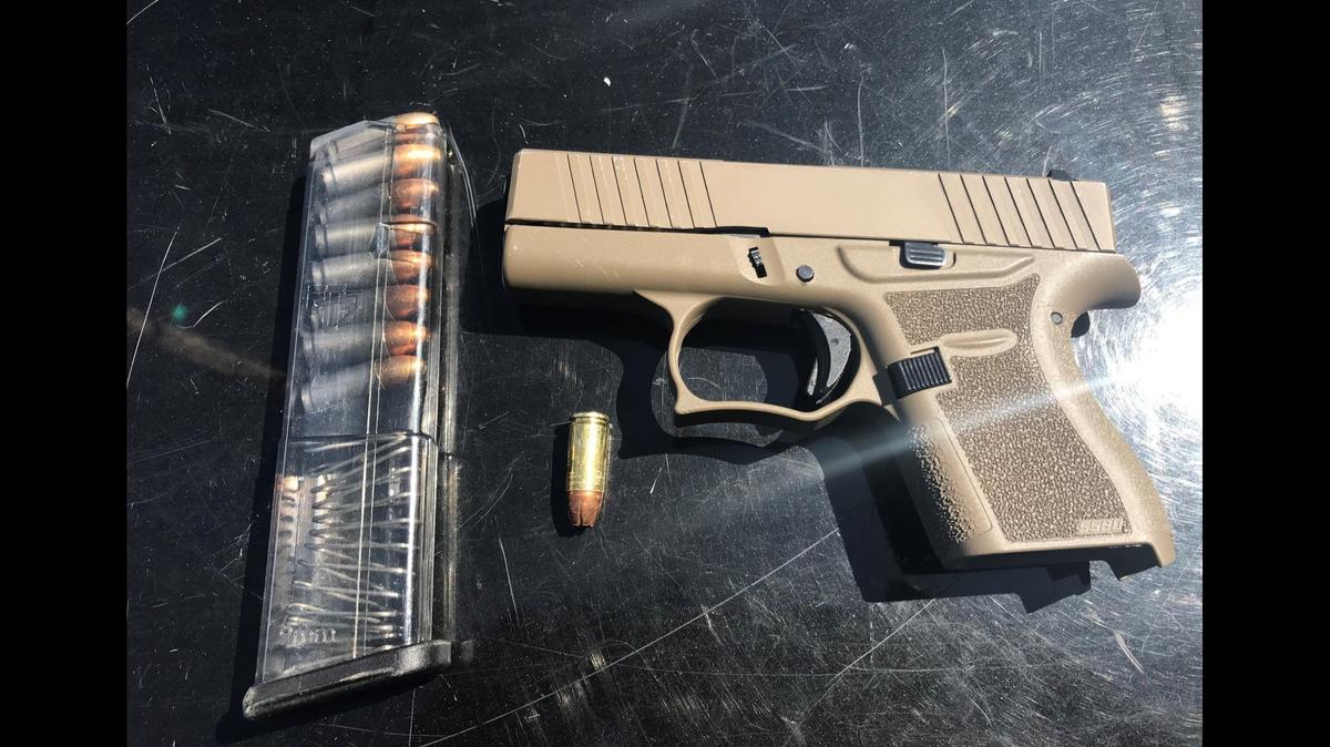 Two juveniles suspected of being gang members, were arrested in Merced on Monday, after a Gang Violence Suppression Unit officer reportedly witnessed one of the juveniles throw a semi-automatic handgun beneath a parked vehicle, according to the Merced Police Department. Image courtesy of Merced Police Department.