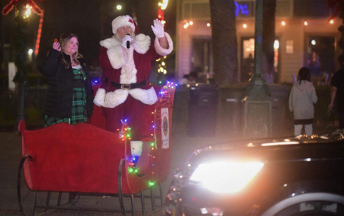 Santa Claus was stationed in front of Bob Hart Square during Merced’s Christmas Tree Lane “reverse parade” on Saturday, Dec. 4, 2021 in Merced, Calif.