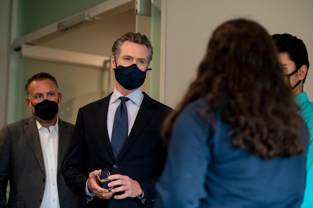 Governor Gavin Newsom speaks with University of California, Merced students students prior to a news conference where he pledged his support for a proposed medical school on the UC Merced campus in Merced, Calif., on Monday, Oct. 25, 2021.