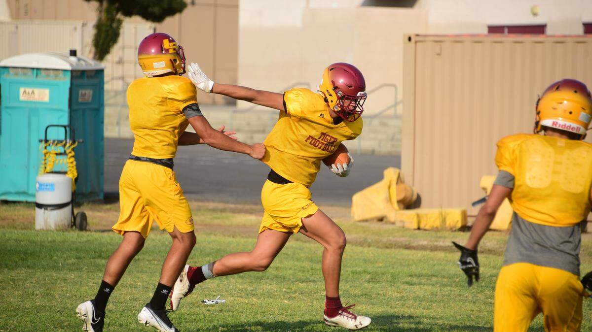 Los Banos receiver JT Archutowski runs after hauling in a catch during practice on Thursday, Aug. 12, 2021.