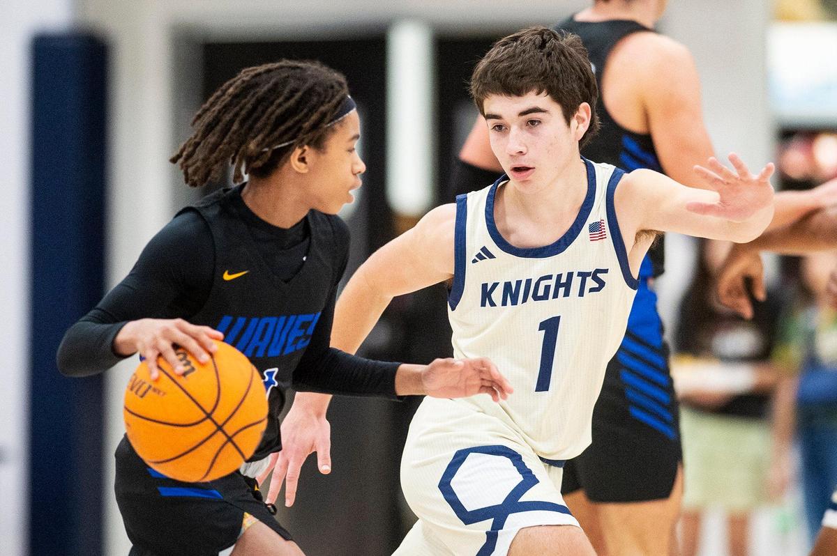 Stone Ridge Christian junior Luke Agueda (1), right, guards Sacramento Waldorf junior Jayden Palmer-Anthony (1), left, during a CIF Sac-Joaquin Section Division 6 playoff game at Stone Ridge Christian High School in Merced, Calif., on Tuesday, Feb. 20, 2024. The Knights beat the Wave 50-37.