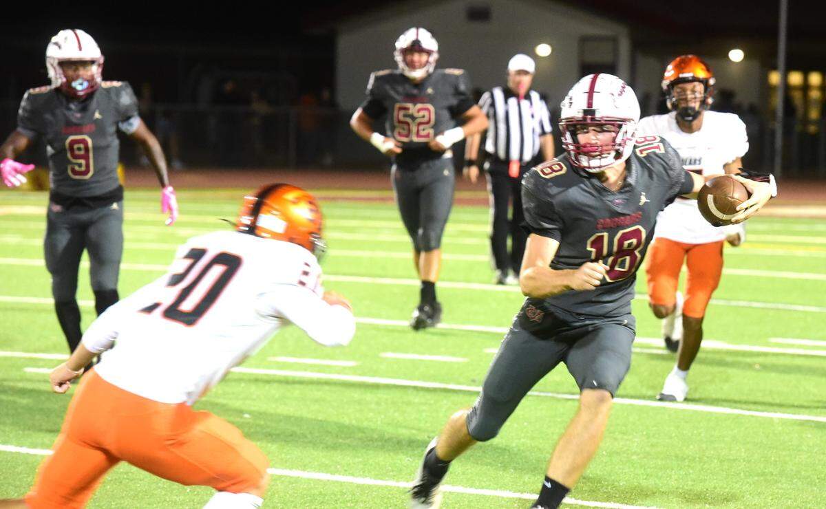 Golden Valley High quarterback Gabriel Richards runs the ball against Merced during a game on Friday, Oct. 4, 2024 at Veterans Stadium.