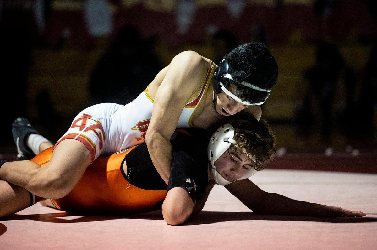 Golden Valley’s Aaron Avila wrestles Merced’s Chris Phillips during a match at Golden Valley High School in Merced, Calif., on Tuesday, Jan. 23, 2024.