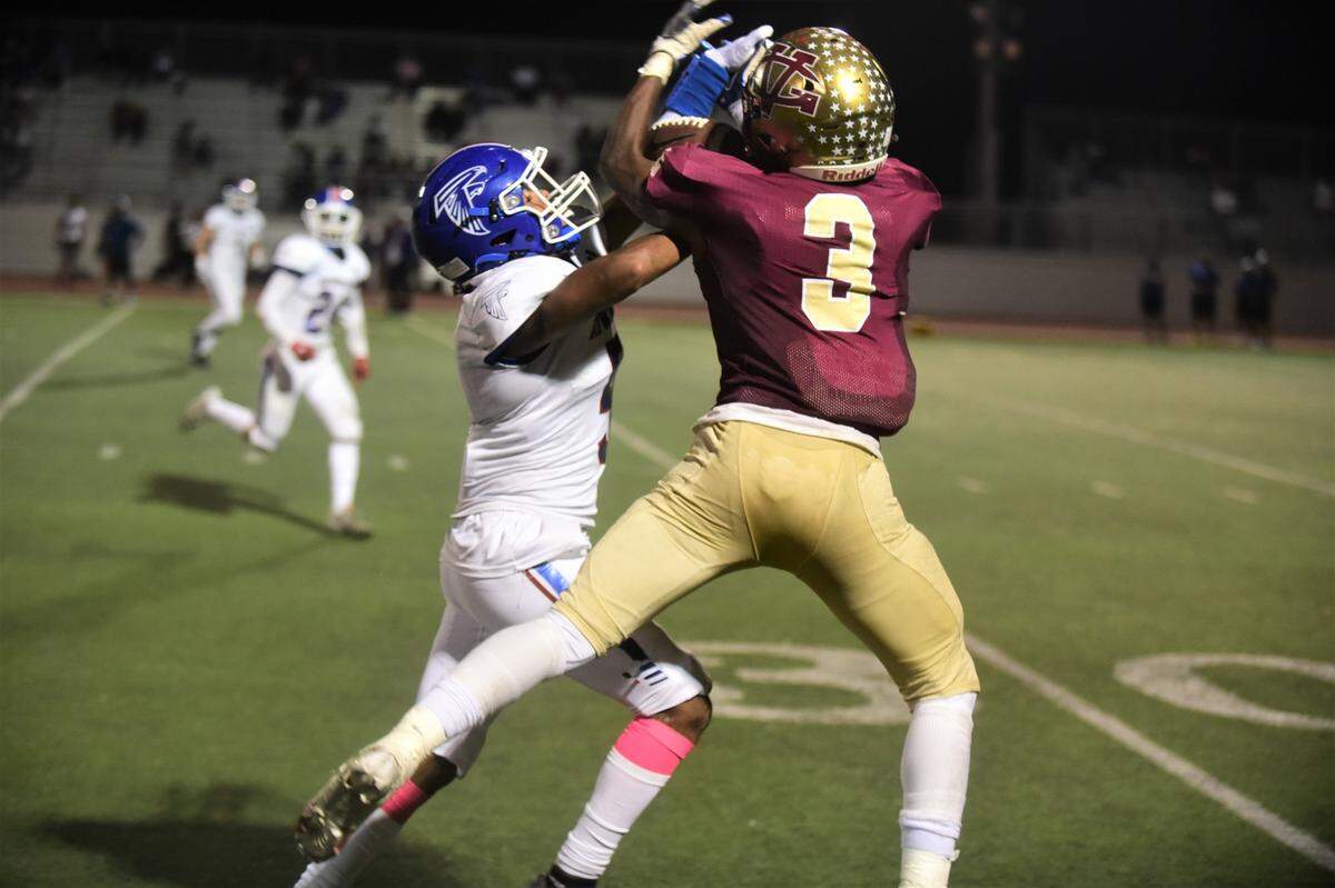 Golden Valley receiver Jonah White (3) somehow brings in this catch against Atwater defensive back Nicholas Mendoza during a game on Friday, Oct. 7, 2022 at Veterans Stadium in Merced, Calif.