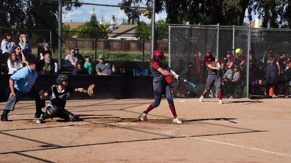 Golden Valley senior Marissa Bertuccio connects on a two-run home run in the fourth inning against Merced. It was the first of two home runs in the game for Bertuccio.