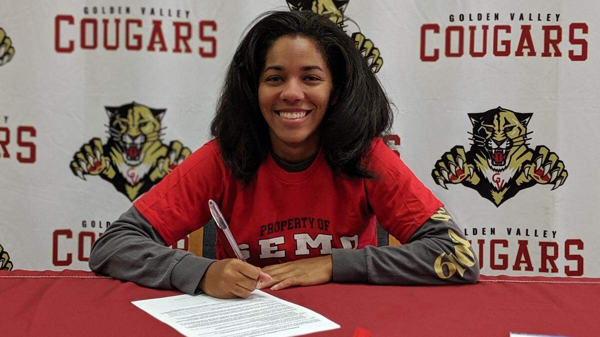 Golden Valley senior Angelena Williams signs her national letter of intent to accept a track and field scholarships to Southeast Missouri State University on Tuesday, May 28, 2019 in the Golden Valley High library.