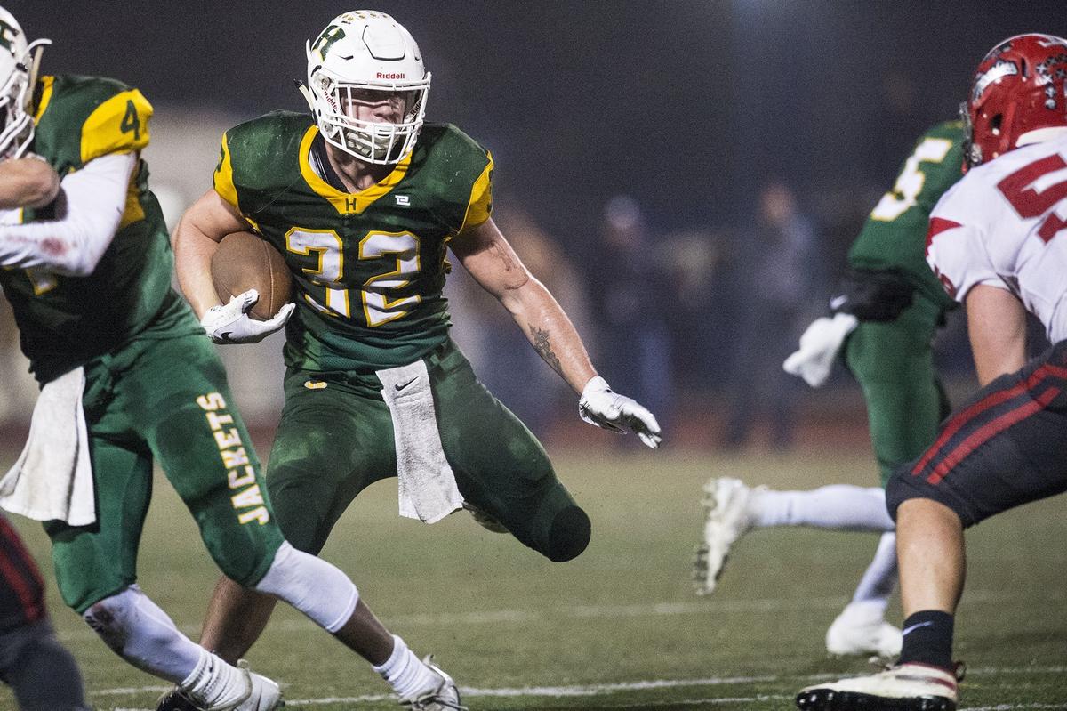 Hilmar senior Justin Rentfro (32) rushes the ball during the Northern California 6-AA Championship game against East Nicolaus at Atwater High School in Atwater, Calif., on Friday, Dec. 7, 2018. The Yellowjackets beat the Spartans 48-14.