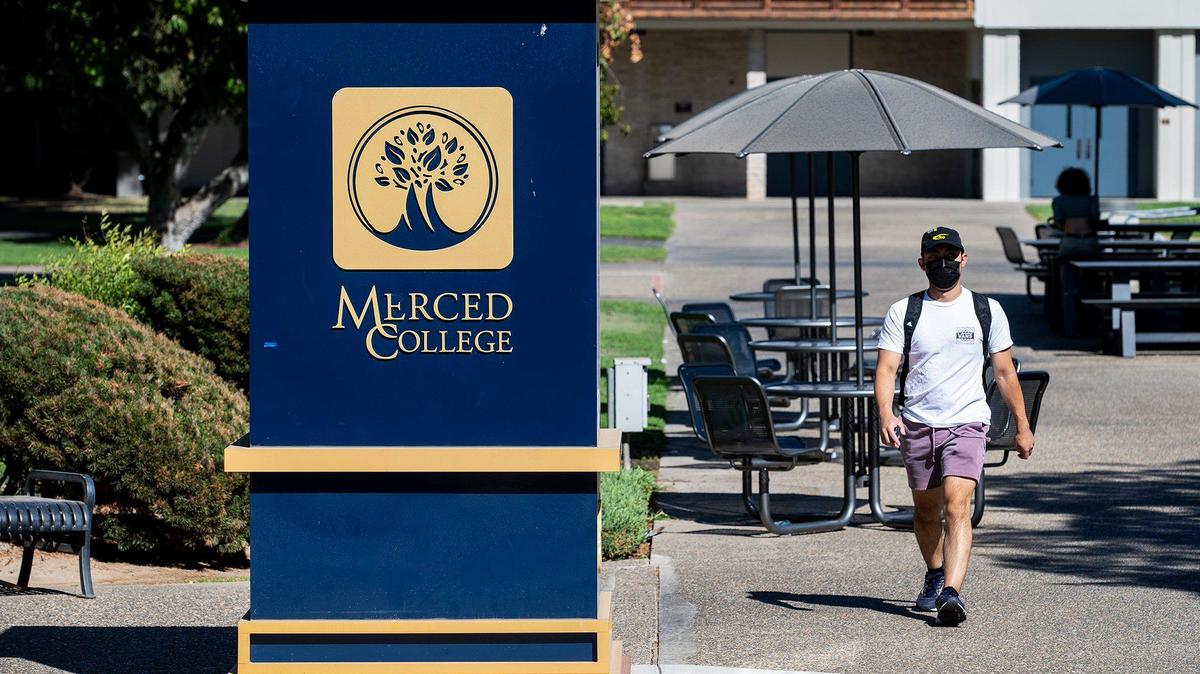 People walk across the campus of Merced College in Merced, Calif., on Thursday, Aug. 25, 2022.