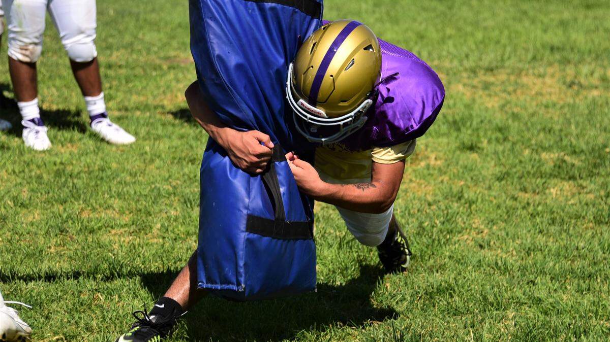 Livingston High School junior Zack Duran participates in a tackling drill during practice on Tuesday, Aug. 1, 2023 at Livingston High School.