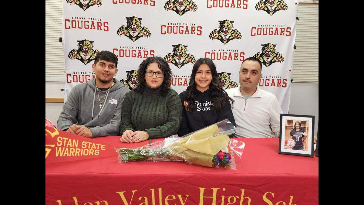 Golden Valley High senior Kayla Perez, center, poses for photos with her brother Adrian, mother Mariela and father Alfredo during her signing ceremony on Friday, Jan. 6, 2023 at Golden Valley High School.