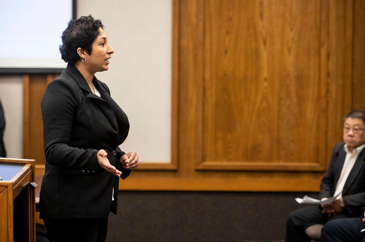 Daniela Ceja-Arceo, 25, speaks to those in attendance after District 5 Supervisor Scott Silveira called a recess during the Merced County Board of Supervisors meeting in Merced, Calif., on Tuesday, Feb. 28, 2023. The recess was called after Ceja-Arceo refused to quit speaking at the end of her allotted time while addressing the board during public comment. Planada residents and community advocates who attended the meeting said the county isn’t doing enough to help the community of Planada following devastating flooding which damaged homes and forced thousands to evacuate.