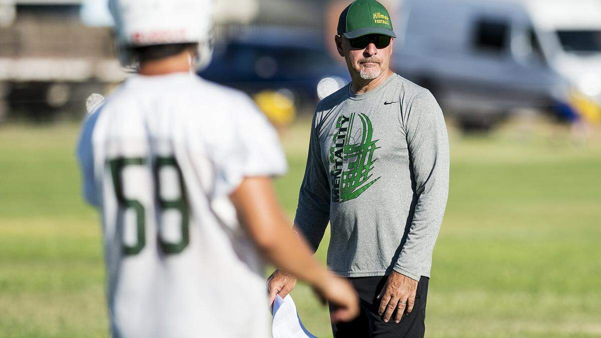 Head coach Frank Marques looks on during football practice at Hilmar High School in Hilmar, Calif., on Wednesday, July 25, 2018. 