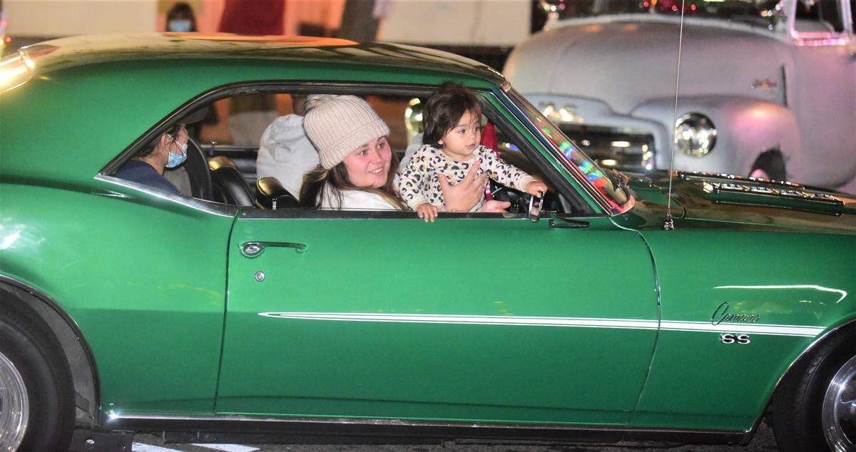 People drove down Main Street to enjoy Merced’s Christmas Tree Lane “reverse parade” on Saturday, Dec. 4, 2021 in Merced, Calif.