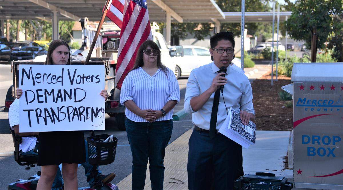 Merced City Council Member candidate for District 6 Fue Xiong speaks to protesters Friday, Oct. 14, 2022, outside the Merced County Elections Office about errors that appeared on election ballots sent out in some Merced County precincts.