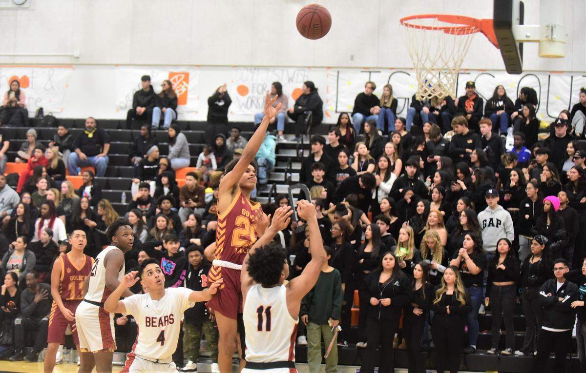 Golden Valley High School junior David Dennis watches a shot go in as the junior scored 16 points in the second half to lead the Cougars to a 51-48 overtime win over Merced at Merced High School on Friday, Jan. 20, 2023.