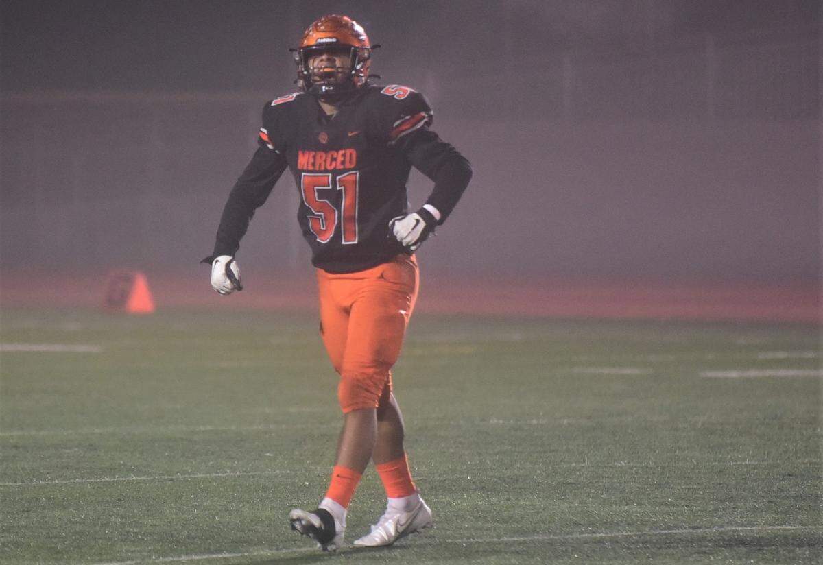 Merced High senior defensive lineman Jaylen Thao-Booth celebrates after recording one of his five sacks during the Bears’ 56-15 win in the second round of the Sac-Joaquin Section Division IV playoffs on Friday, Nov. 12. 2021 at Veterans Stadium in Merced, Calif.