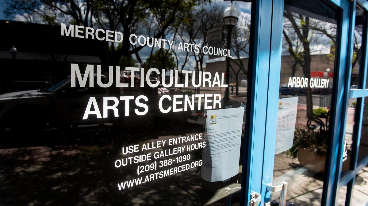 A sign hangs last Thursday on the door of the Merced Multicultural Arts Center, located at 645 W. Main Street, informing the public of a temporary closure due to the coronavirus.
